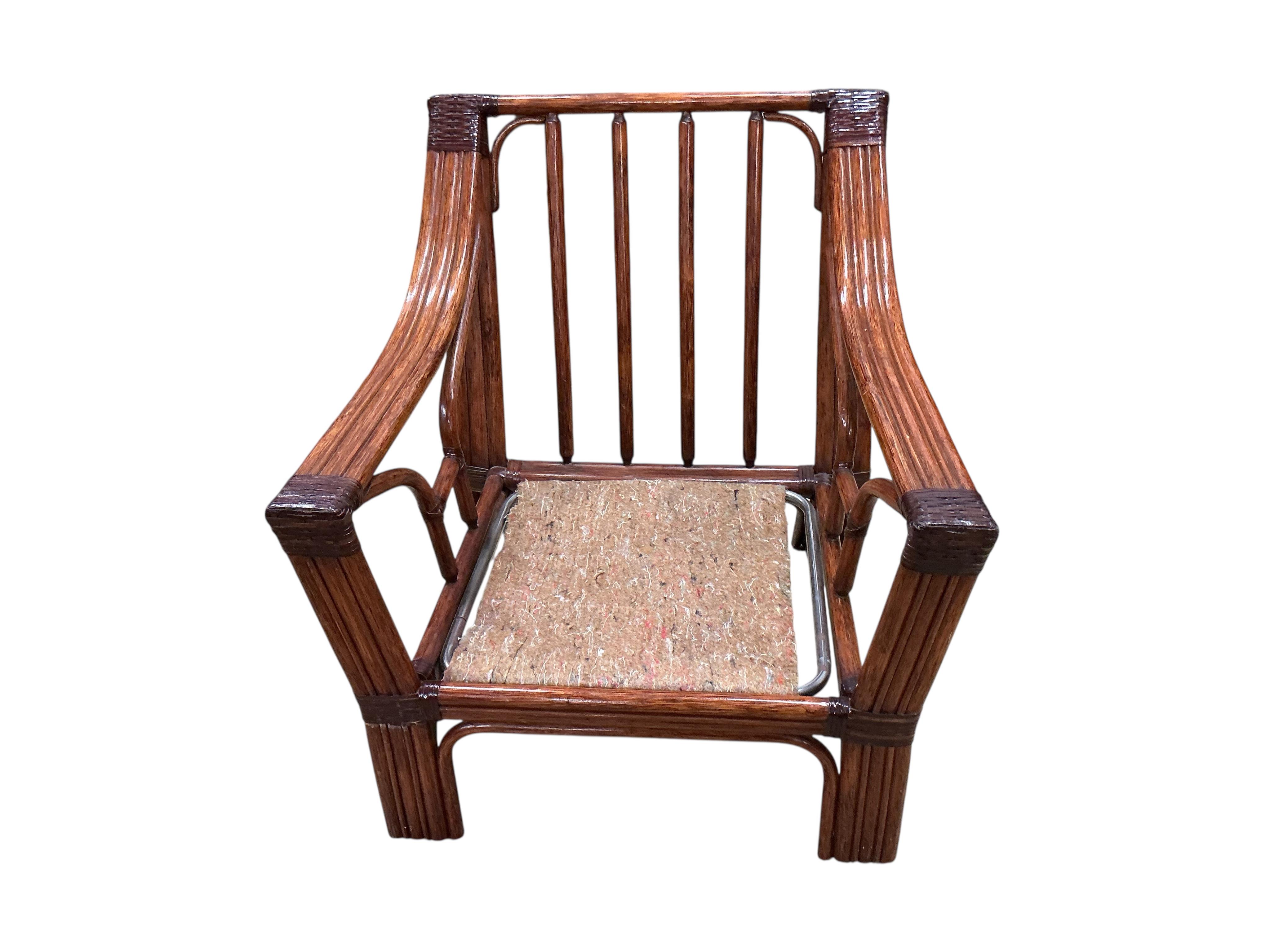 A mid century Roche Bobois faux bamboo three piece suite, lacking some cushions